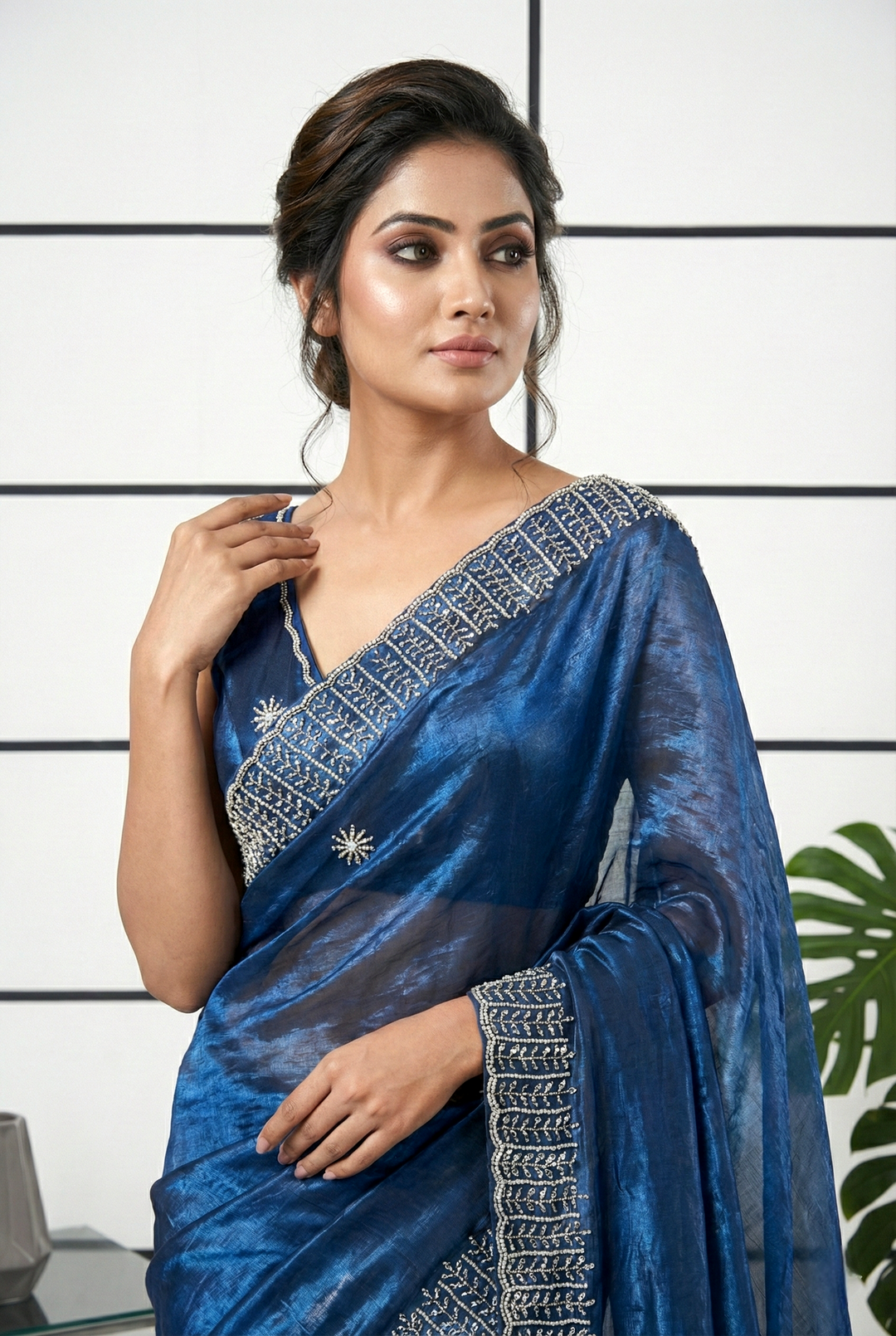 Neerus Blue organza embellished saree with peacock stone motif - side view