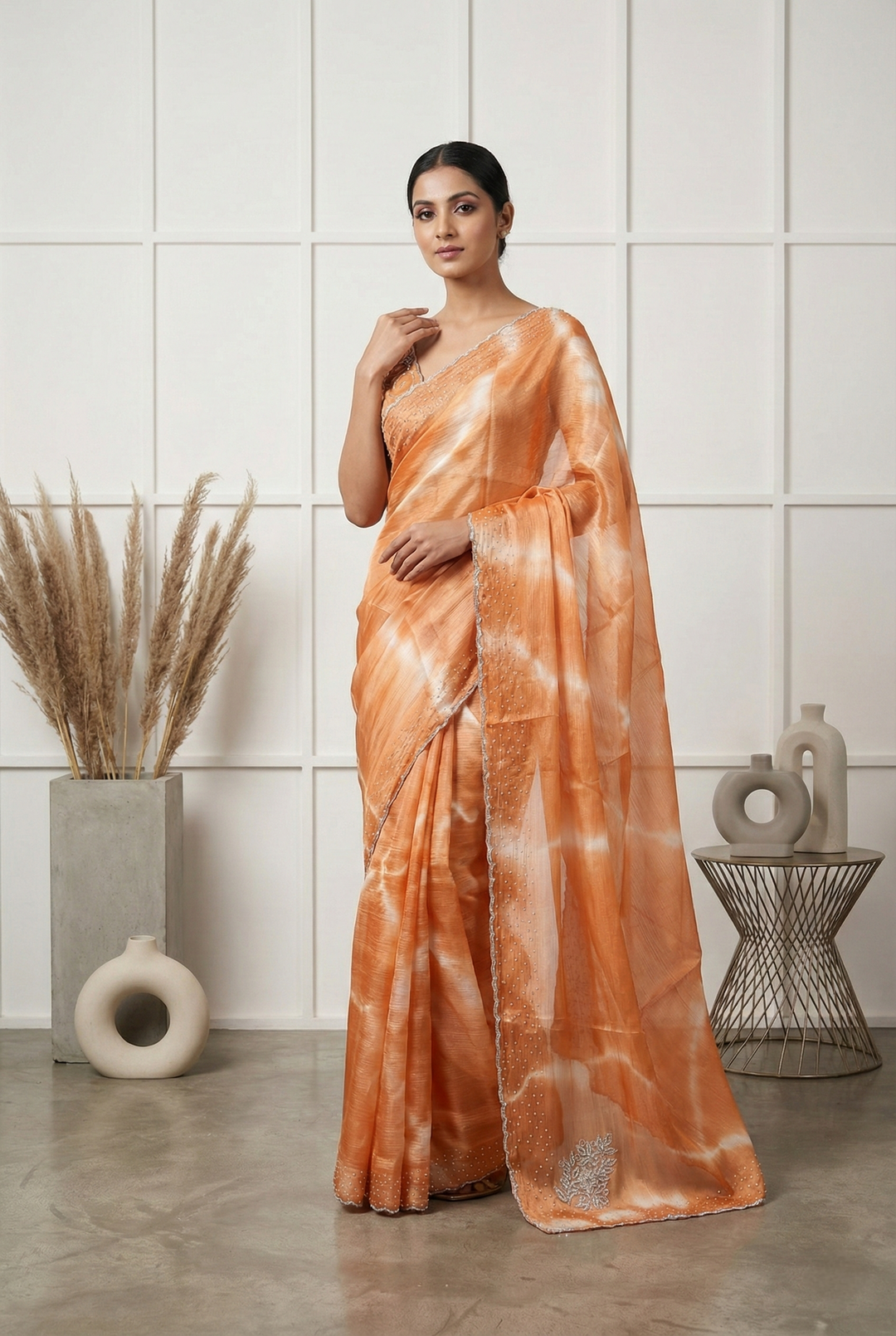 Neerus Orange organza embellished saree - front view