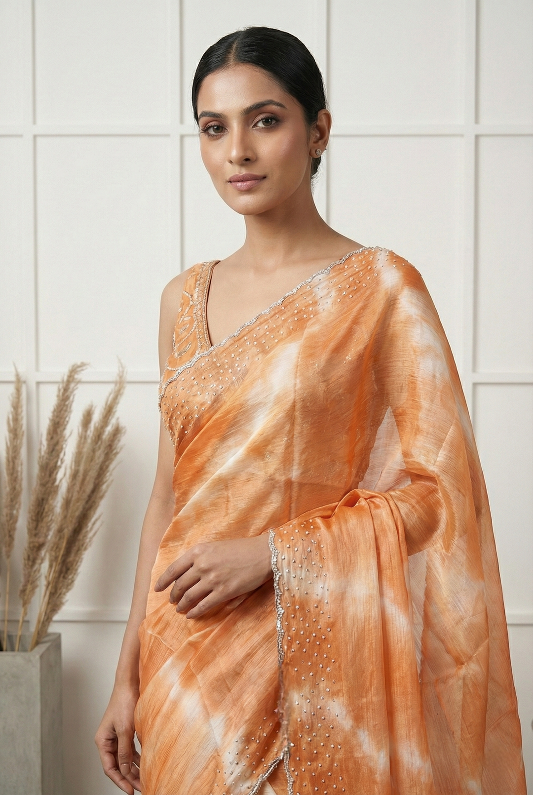 Neerus Orange organza embellished saree - back view