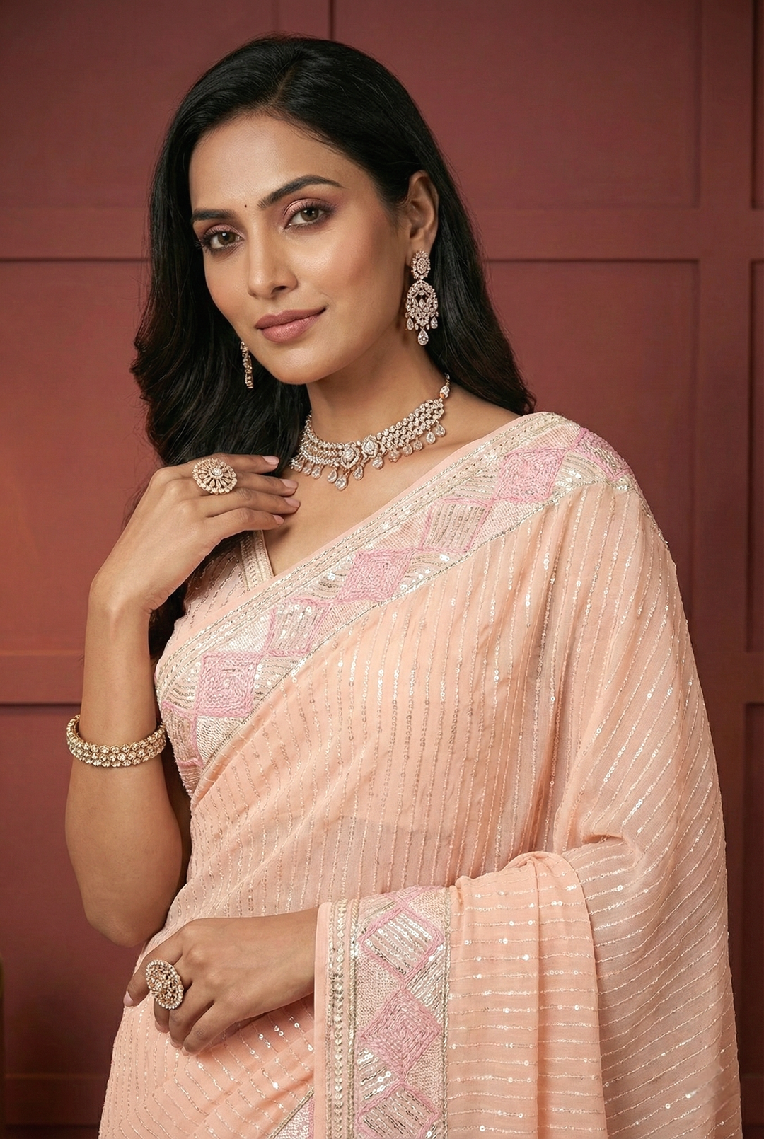 Neerus Pink georgette embellished saree - back view