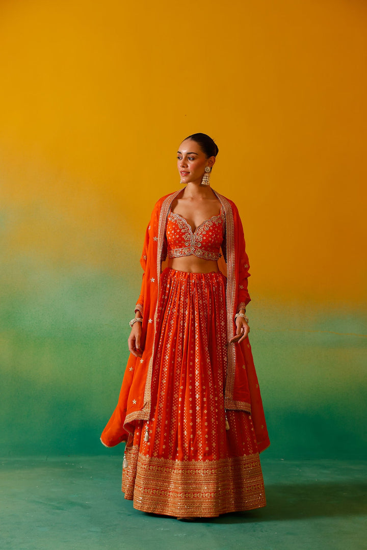 Neerus Orange Georgette Embroidered Lehenga Set - back view