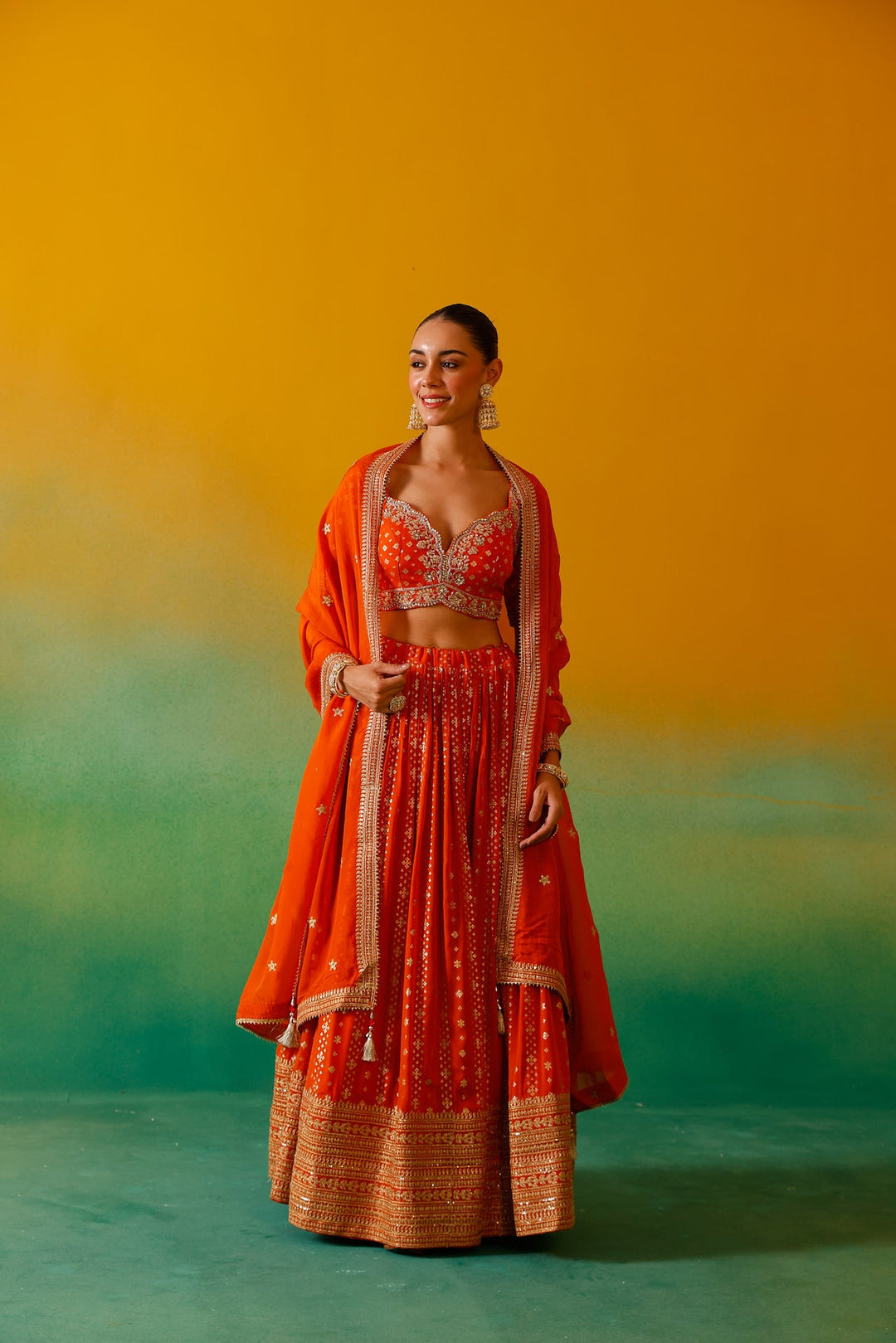 Neerus Orange Georgette Embroidered Lehenga Set - side view
