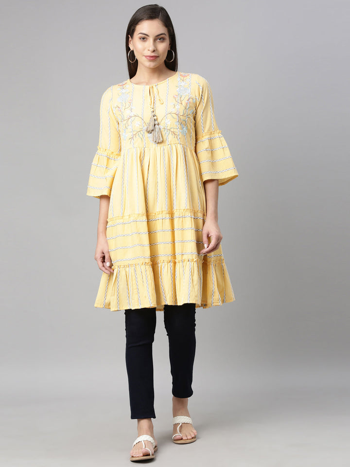 Neerus Yellow floral printed tiered kurti - front view