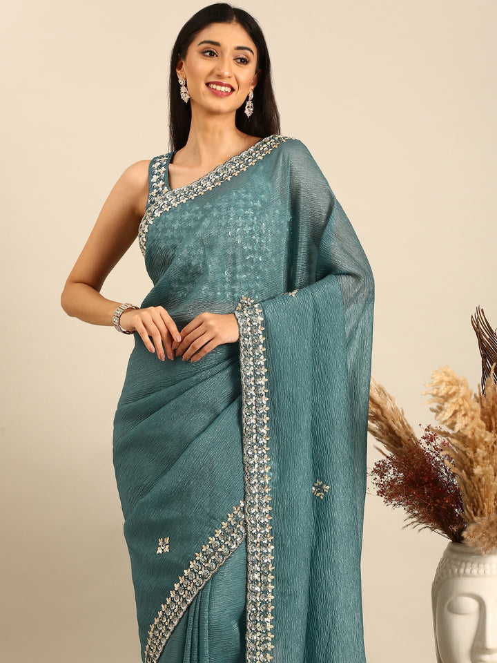 Neerus Green tissue embellished saree with heavy blouse - side view