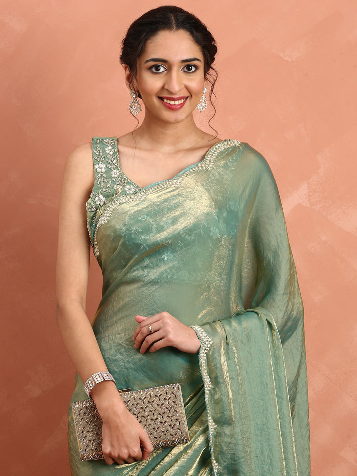 Green & gold Jimmy tissue saree with hand embroidery with ready made blouse