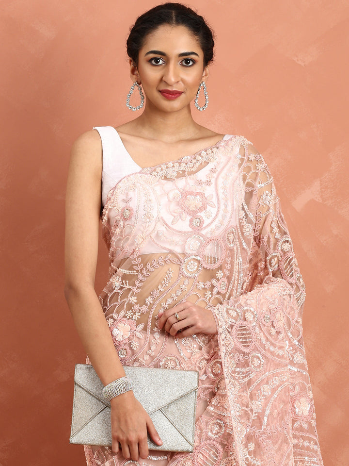 Peach net saree with pearl and sequins hand embroidery with scallop border