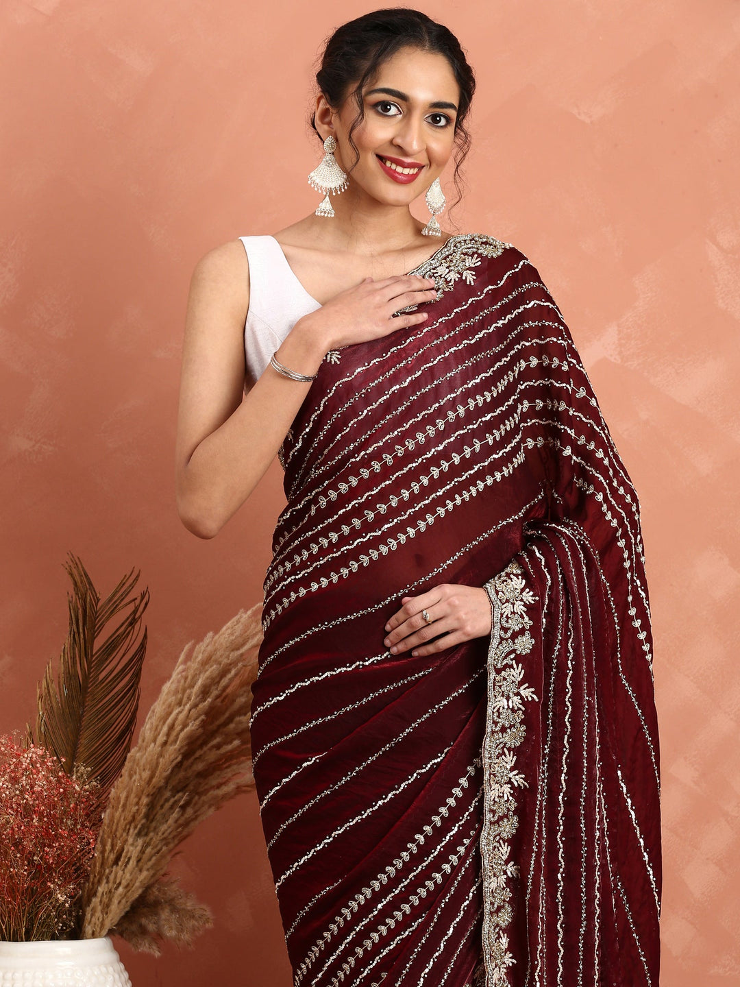 Neerus Maroon hand embroidered saree with Swarovski and cut dana - back view
