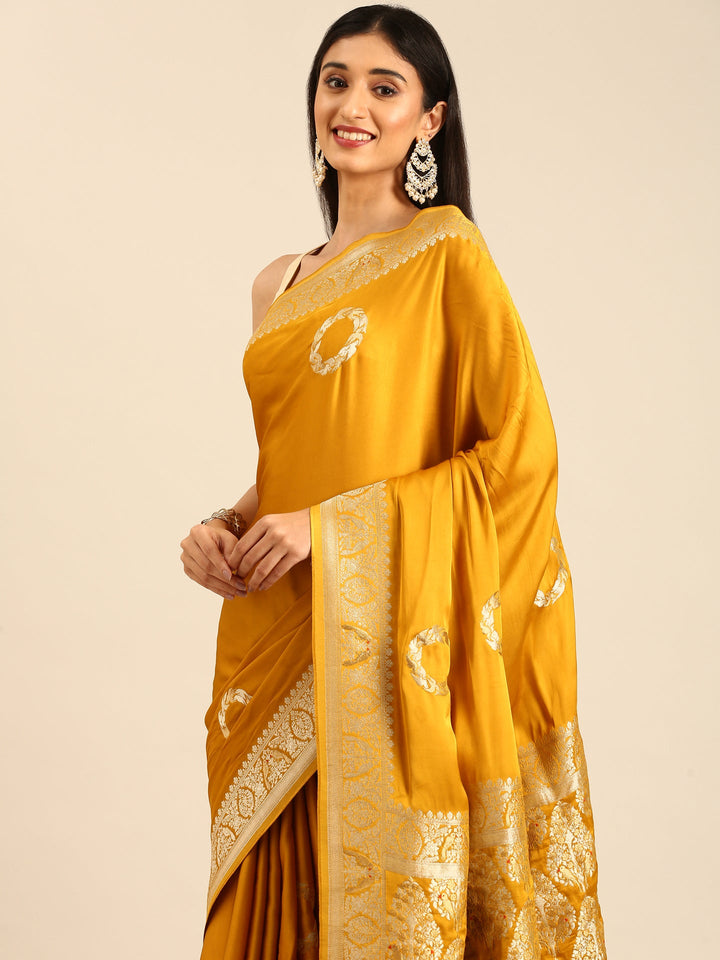 Neerus Yellow Banarasi woven saree with zari border - back view