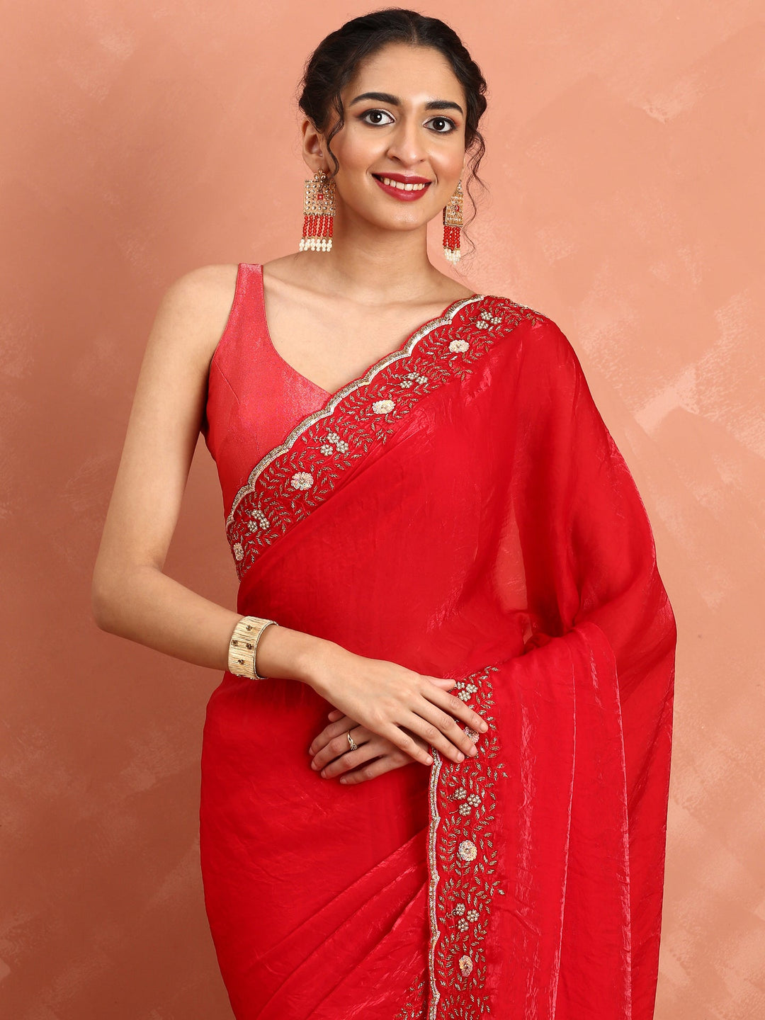 Neerus Red hand embroidered saree with Swarovski stones - side view