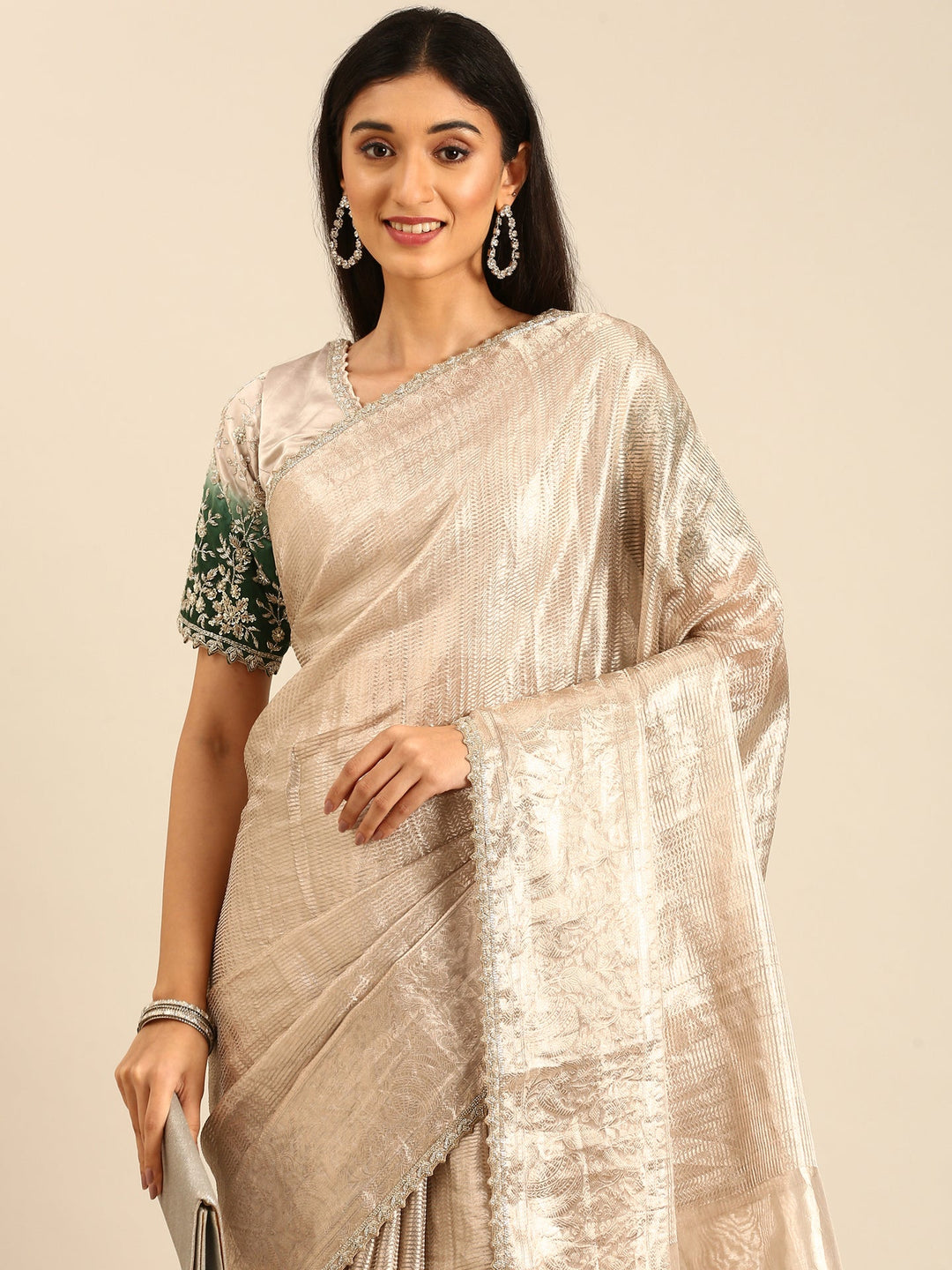 Neerus Grey tissue woven saree with green contrast blouse - side view