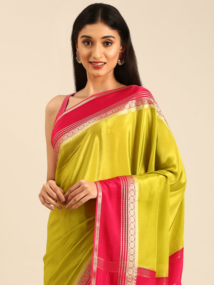 Neerus Green silk woven saree with contrast border and pallu - side view