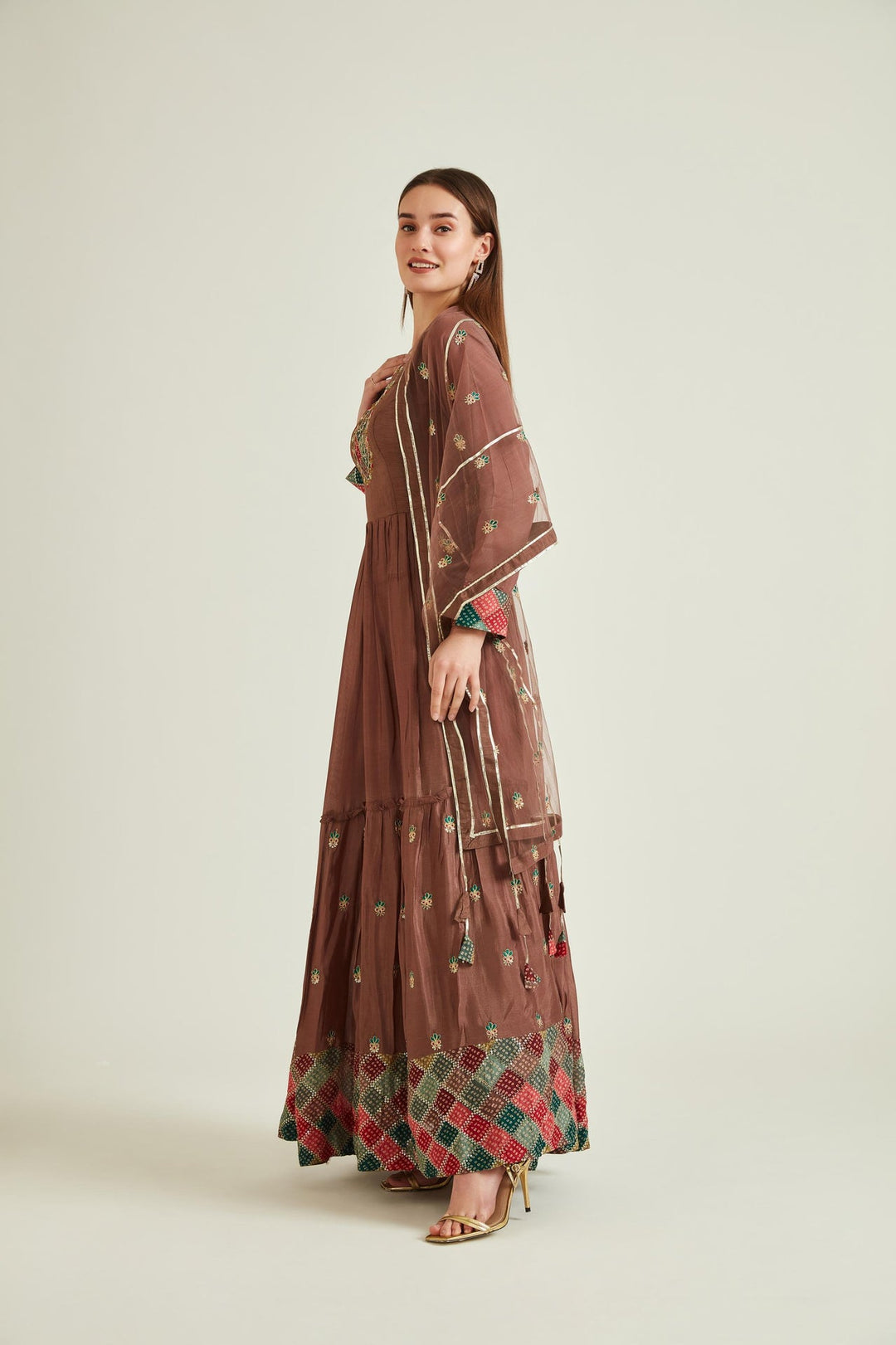 Neerus Brown silk mirror work tiered gown with net dupatta - back view