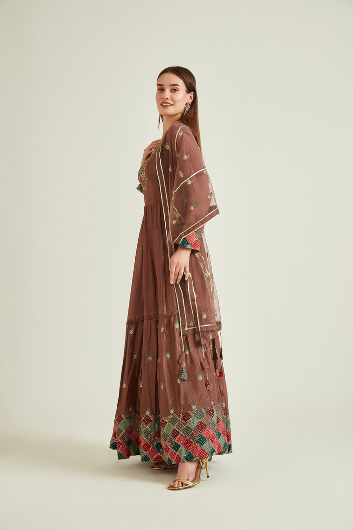 Neerus Brown silk mirror work tiered gown with net dupatta - back view