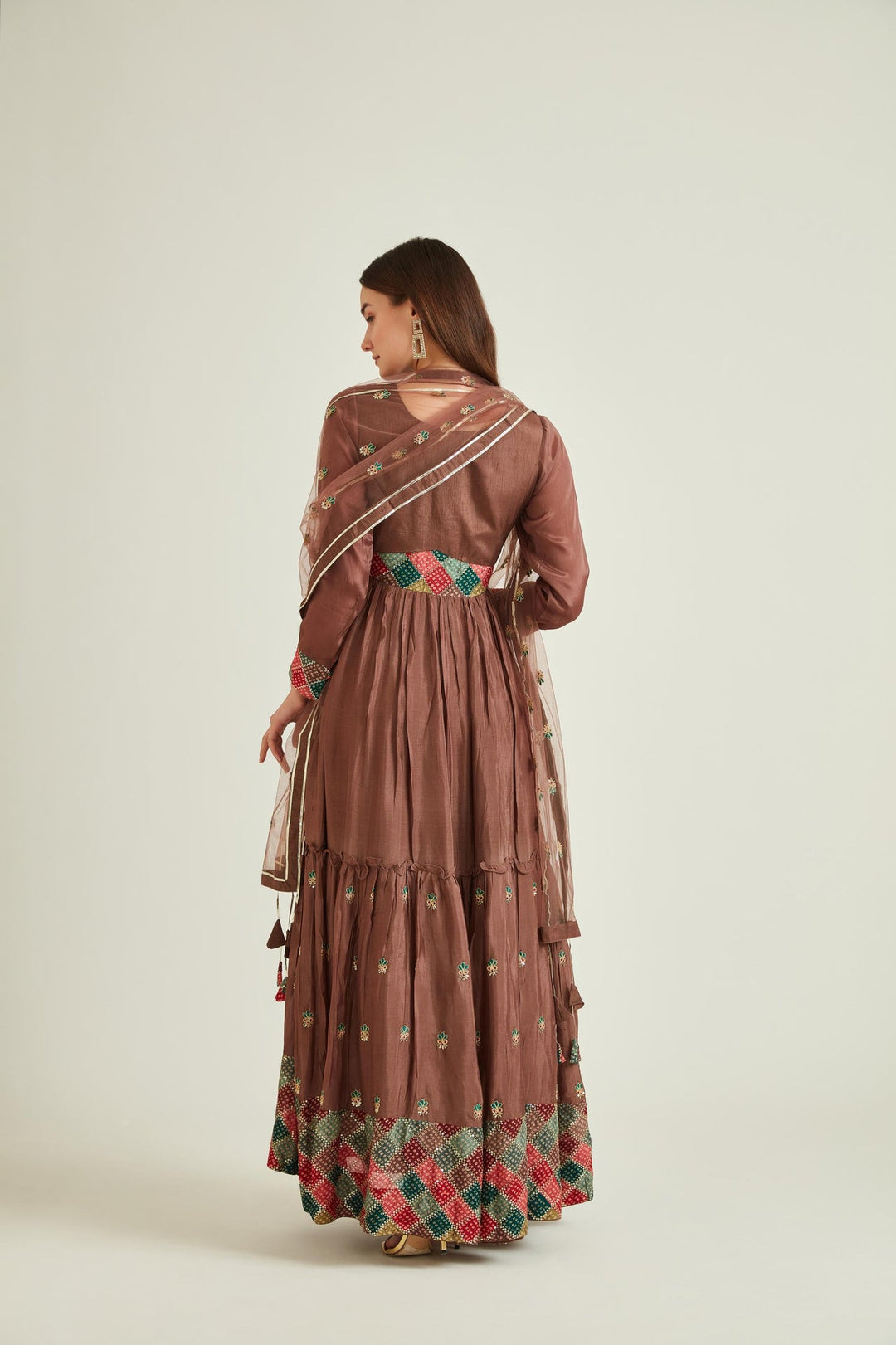 Neerus Brown silk mirror work tiered gown with net dupatta - side view