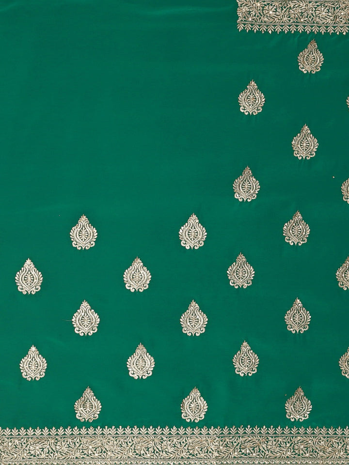 Neerus Green georgette textured saree with blouse - side view