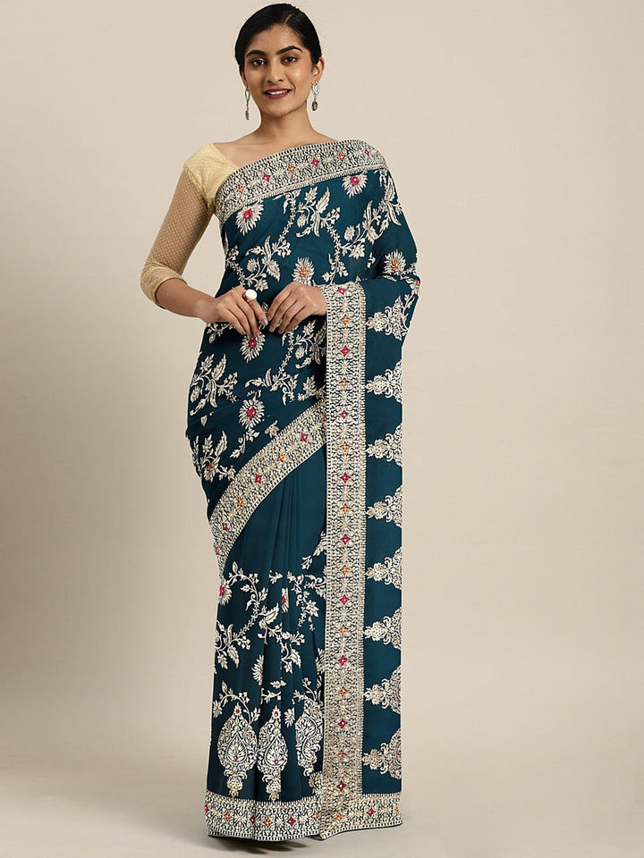 Neerus Green georgette textured saree with blouse - front view