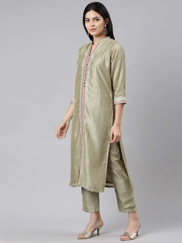 Neerus Green raw silk solid kurta set with trousers - back view