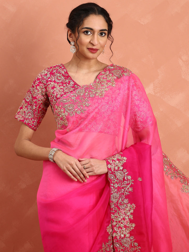 Rani pink pure organza saree with heavy blouse with pearl and cut dana embroidery