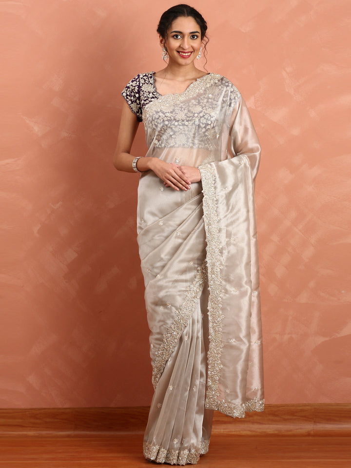 Silver tissue saree with Zari embroidery and contrast blouse