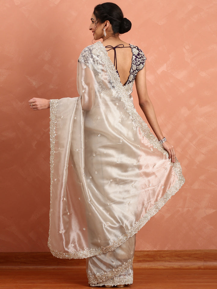 Silver tissue saree with Zari embroidery and contrast blouse