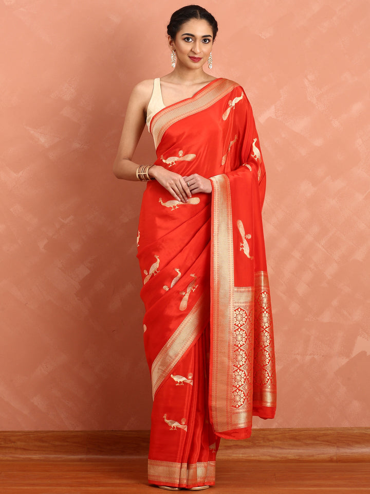 Neerus Red silk woven saree with peacock booti pallu - back view
