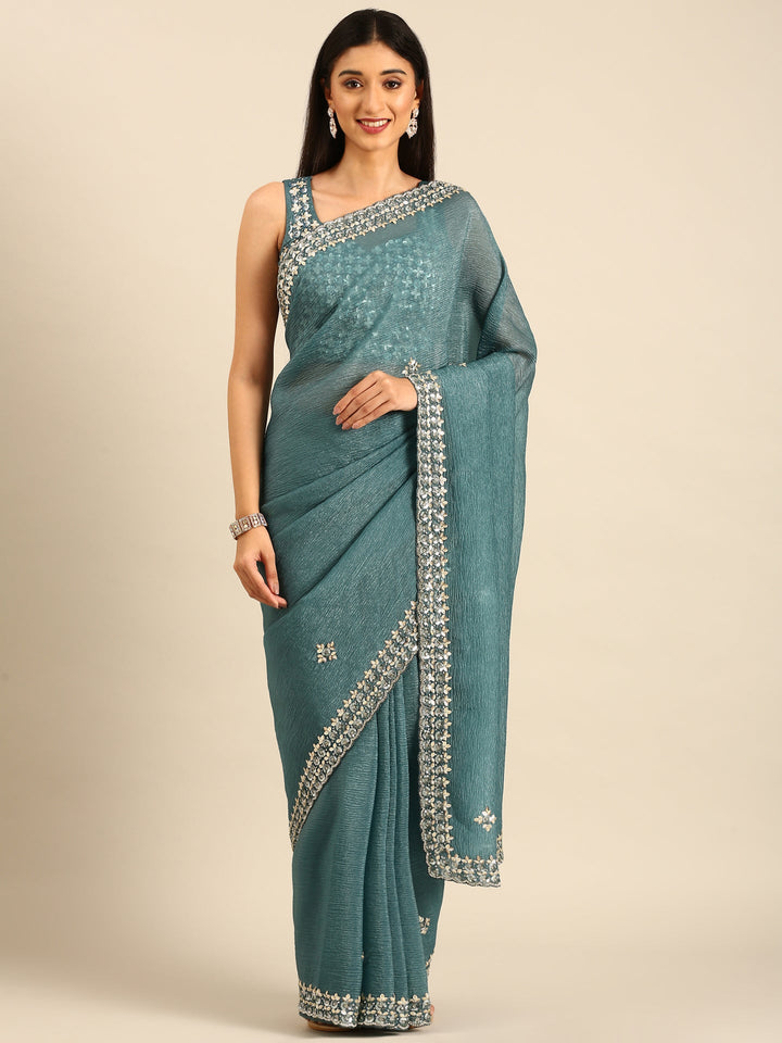 Neerus Green tissue embellished saree with heavy blouse - front view