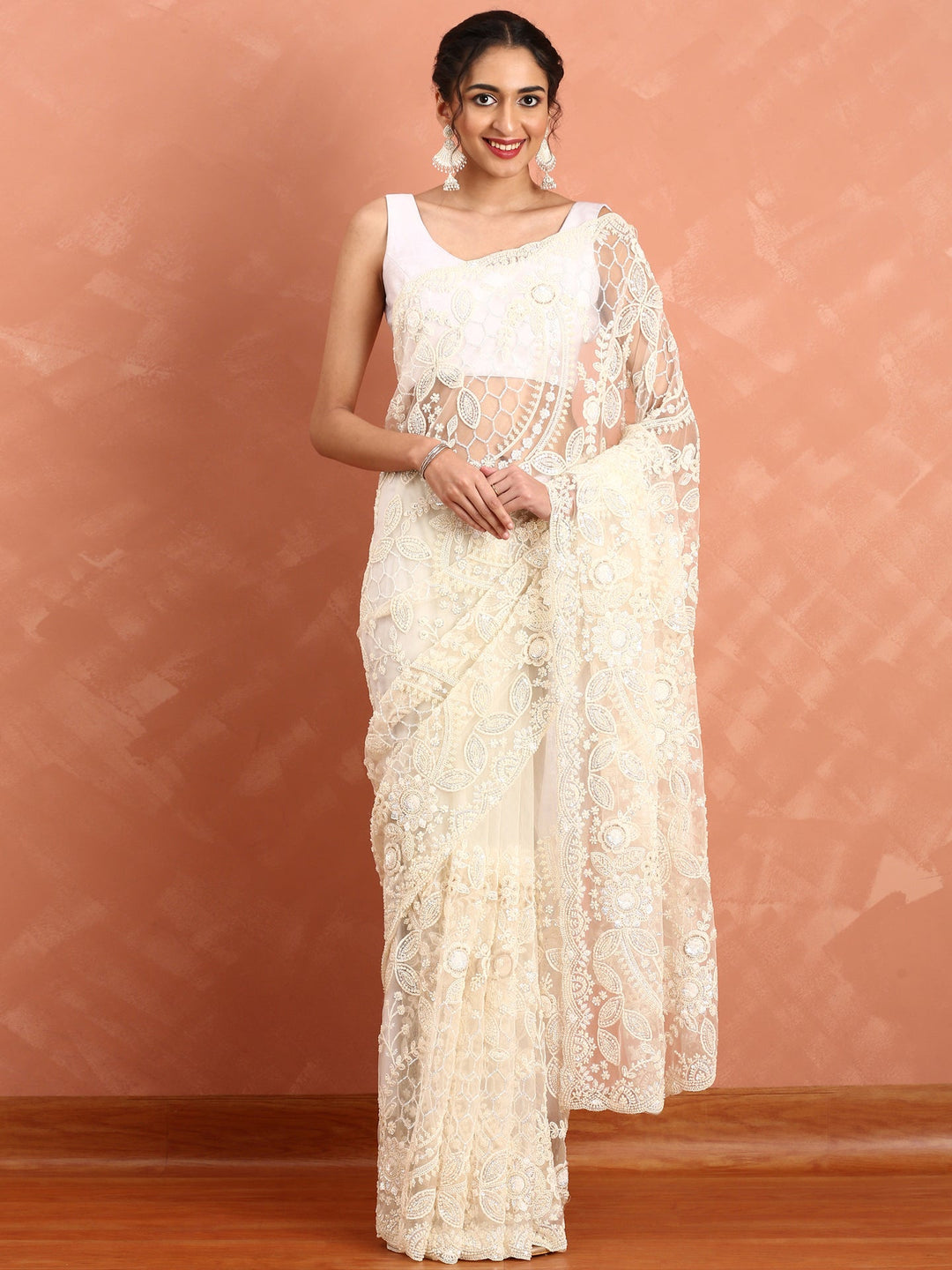 Neerus Beige net hand embroidered saree with pearl sequins - front view