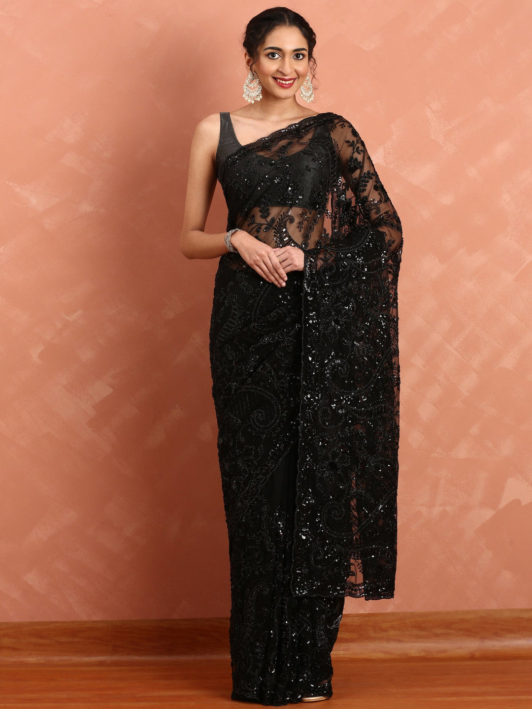 Neerus Black net hand embroidered saree with sequins - front view
