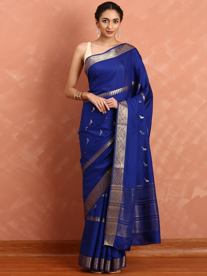 Neerus Blue Silk Woven Saree with Ethnic Pichvai Motifs - front view