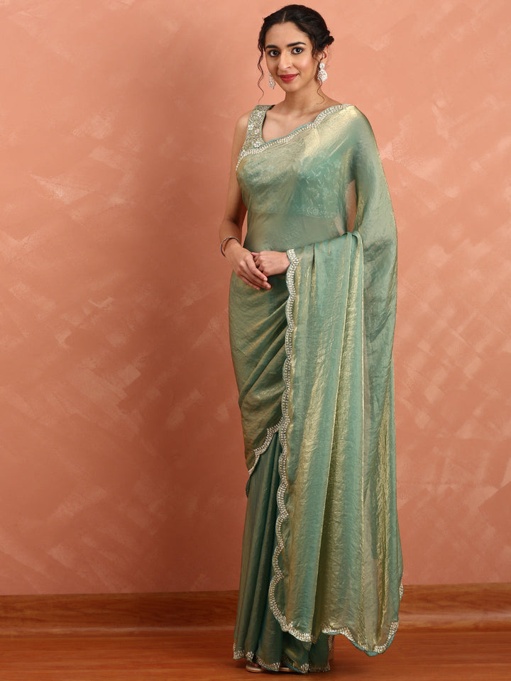 Green & gold Jimmy tissue saree with hand embroidery with ready made blouse