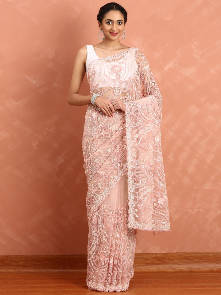 Peach net saree with pearl and sequins hand embroidery with scallop border