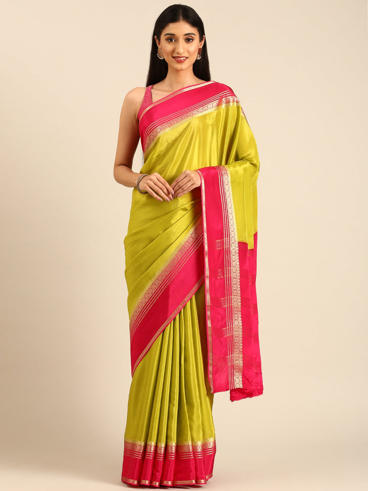 Neerus Green silk woven saree with contrast border and pallu - front view