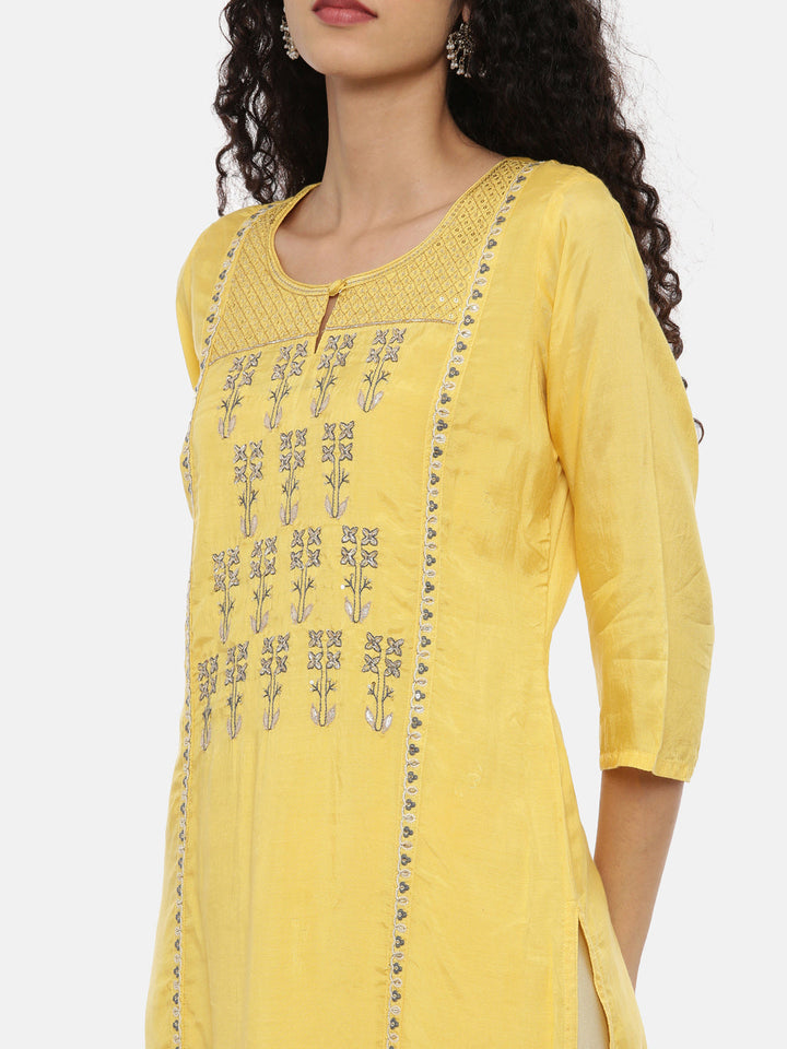 Neerus Yellow muslin woven straight kurti - back view