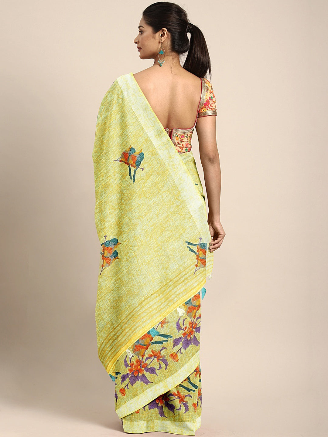 Neerus Green georgette printed saree with blouse - back view