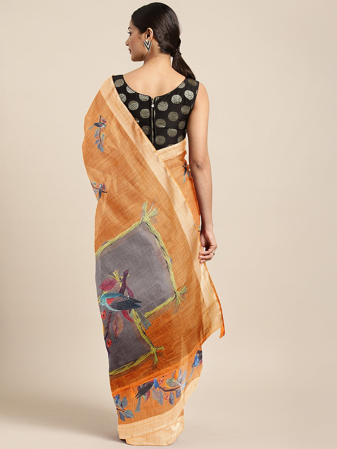 Neerus Orange printed saree with blouse piece - back view