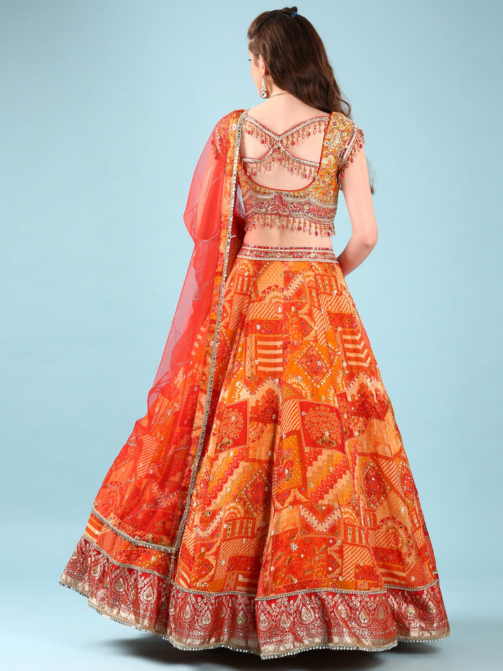 Neerus Orange Chinon hand embroidered ghagra lehenga set - side view