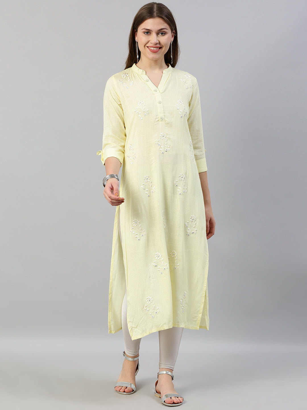 Neerus Yellow rayon embroidered straight kurti - front view