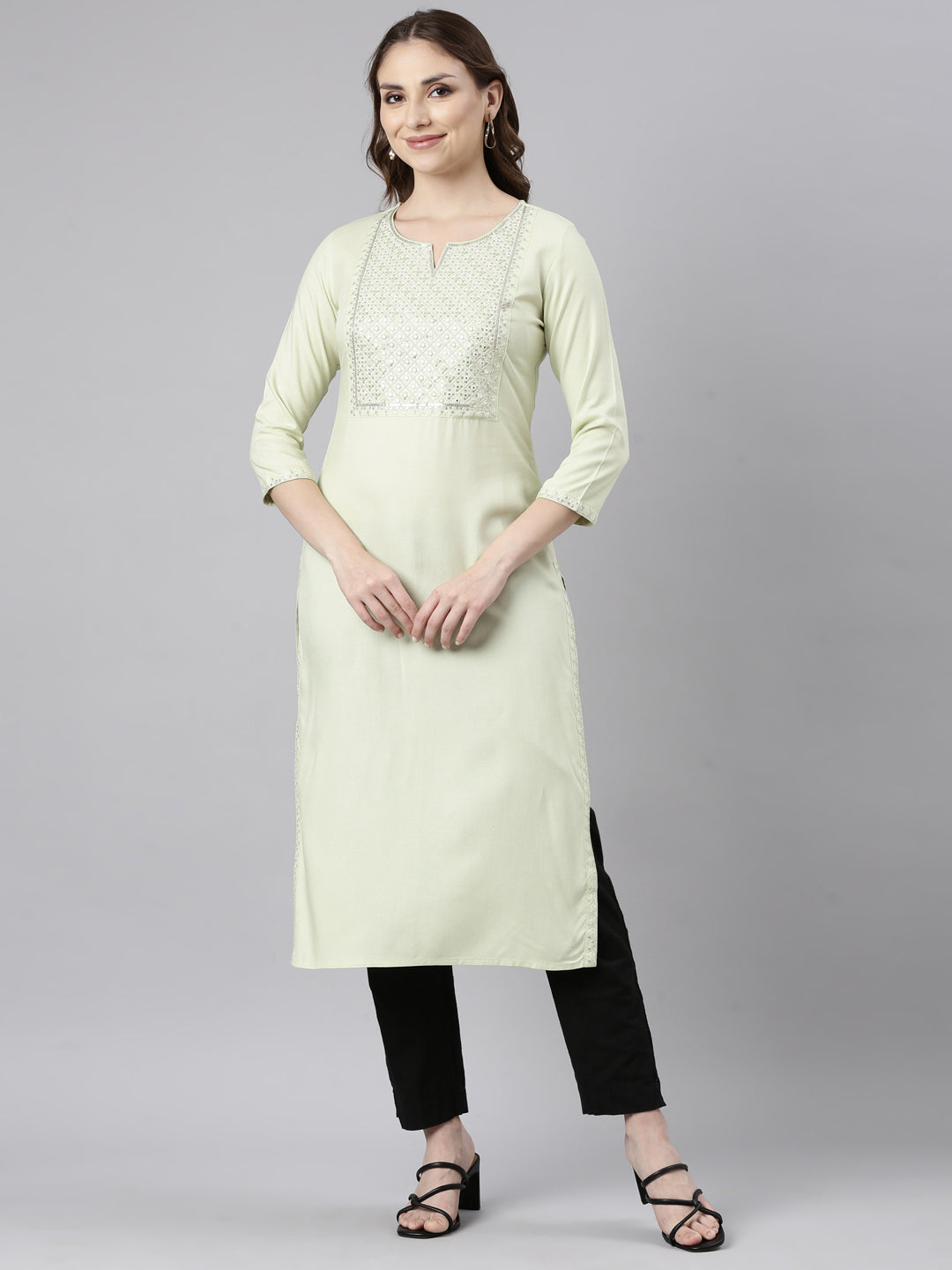 Neerus Green rayon solid straight kurti - front view