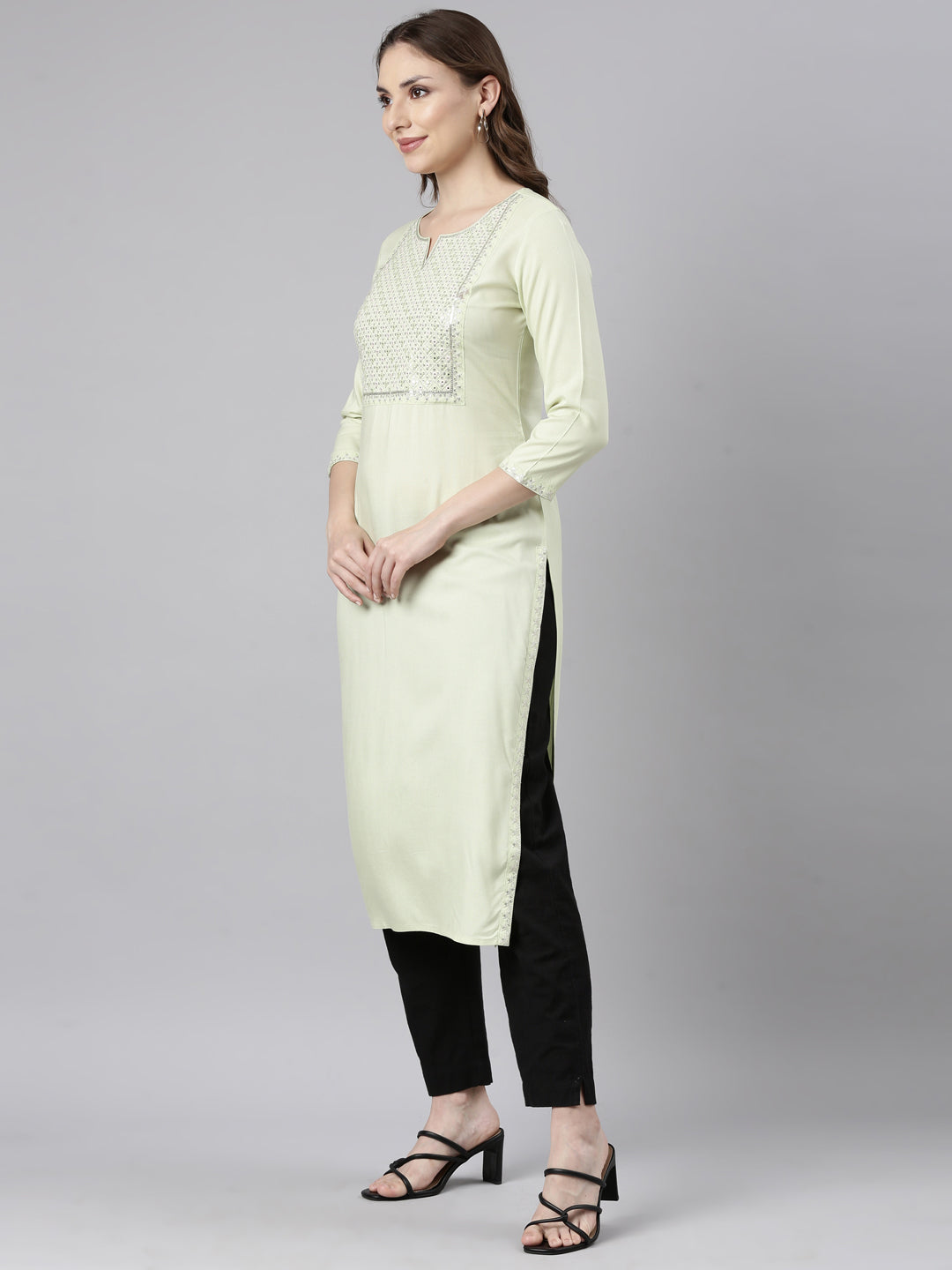 Neerus Green rayon solid straight kurti - back view