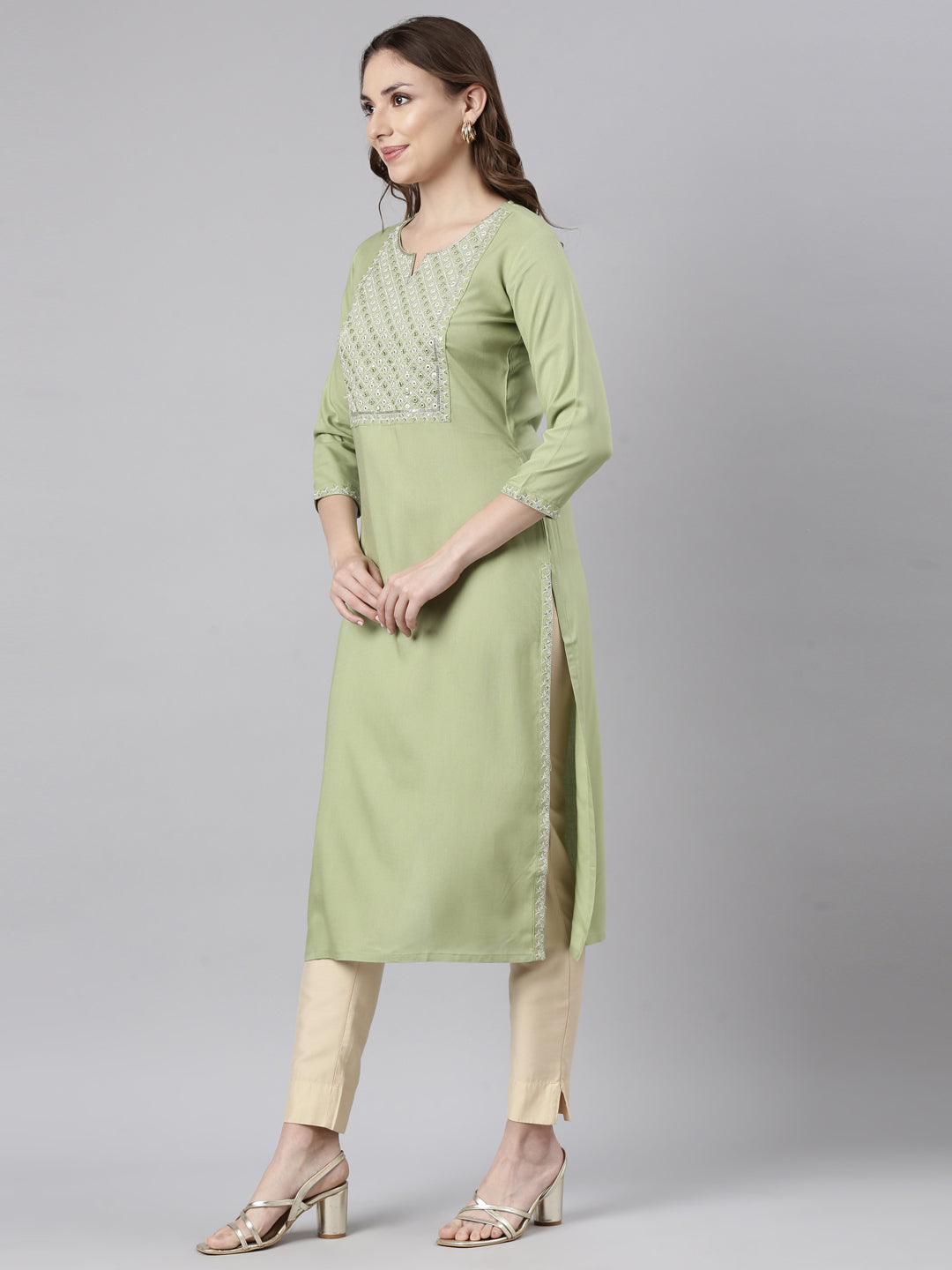 Neerus Green rayon solid straight kurti - back view