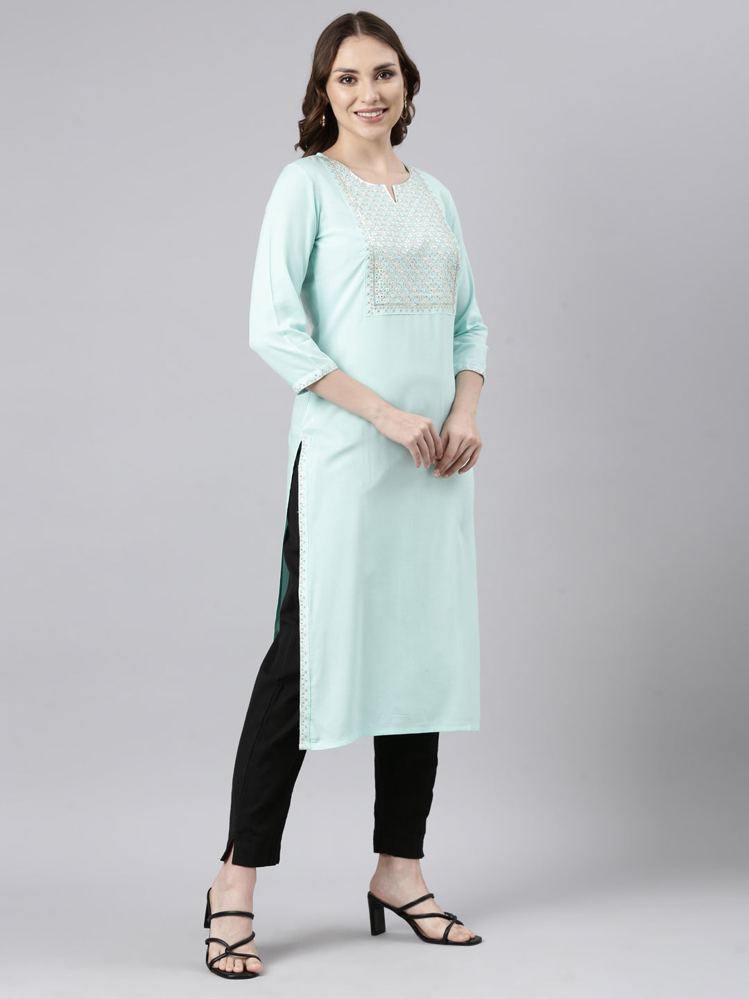 Neerus Green solid straight panelled kurti - back view