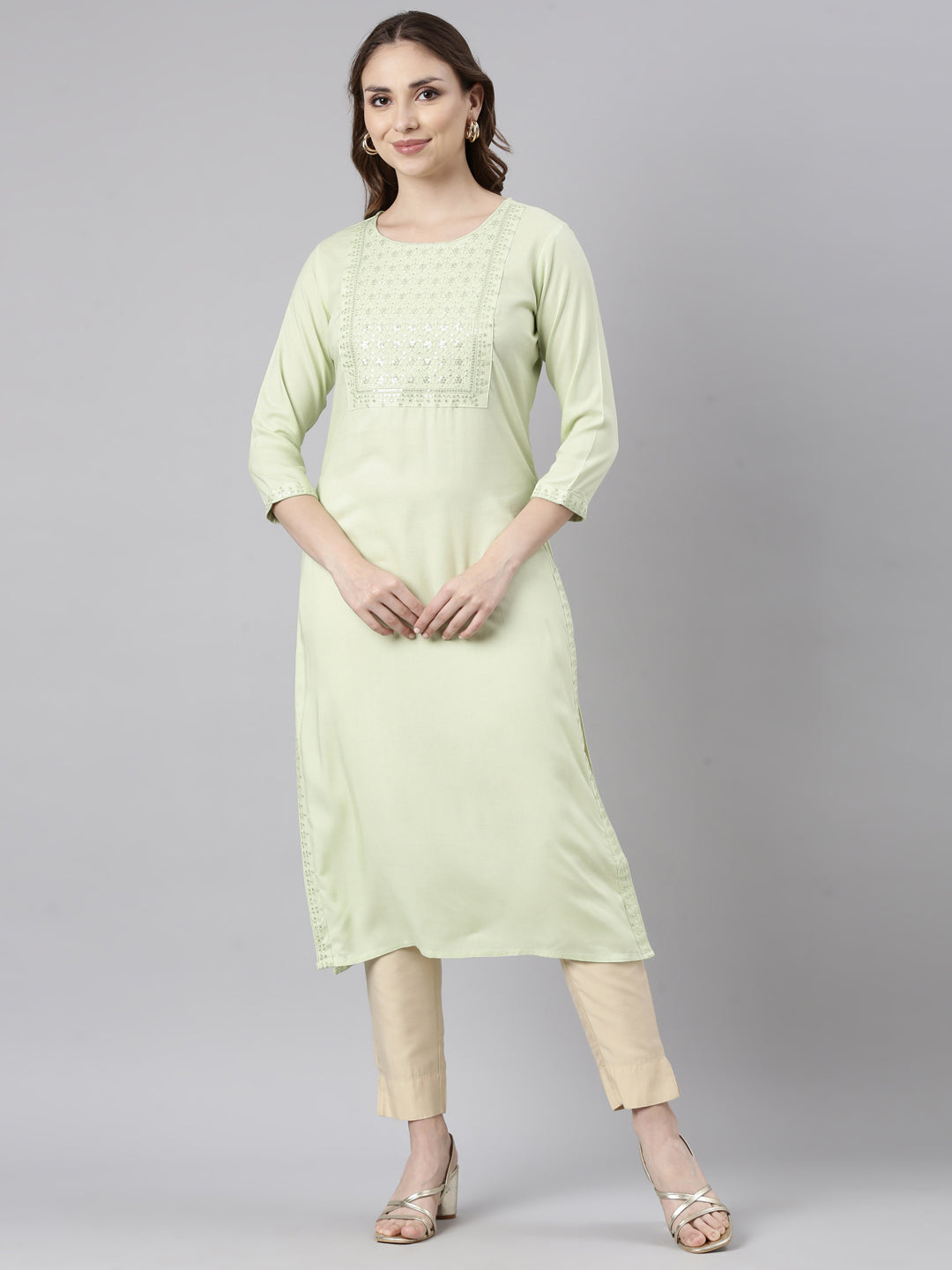 Neerus Green viscose rayon solid straight kurti - front view