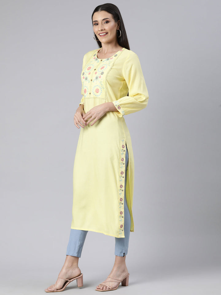 Neerus Yellow cotton solid straight kurti - back view
