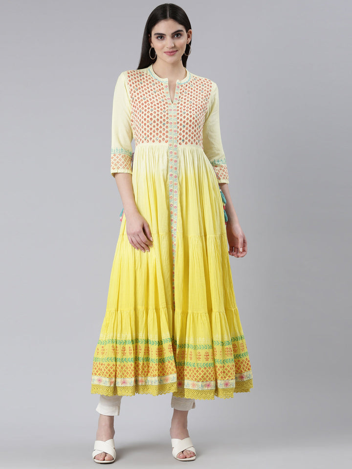 Neerus Yellow cotton printed flared kurti - front view