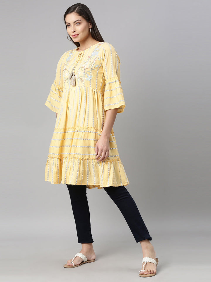 Neerus Yellow floral printed tiered kurti - back view