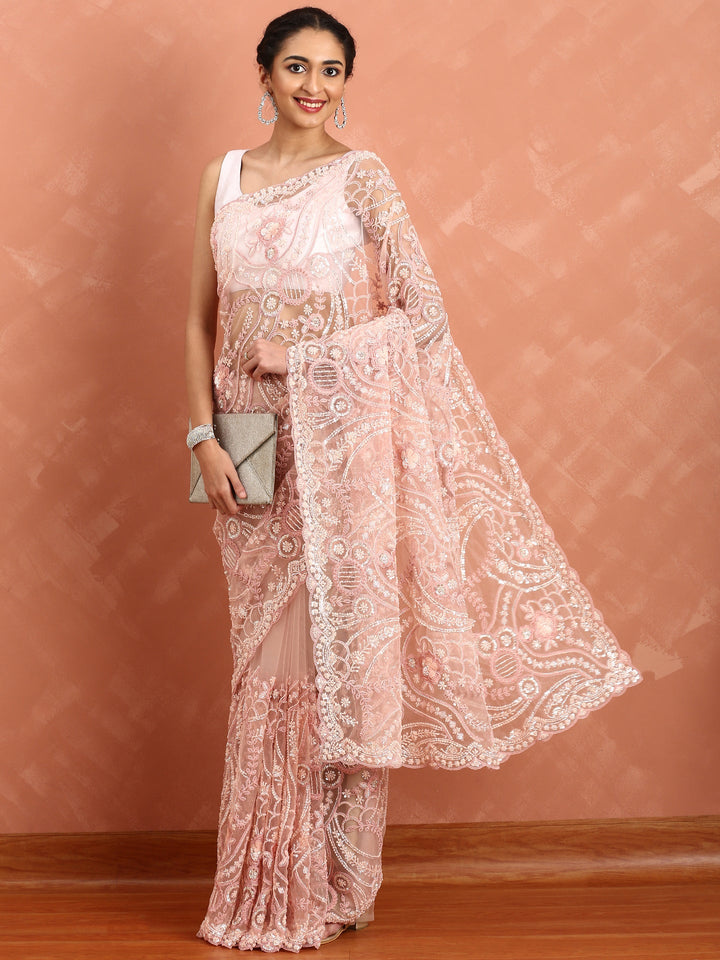 Peach net saree with pearl and sequins hand embroidery with scallop border