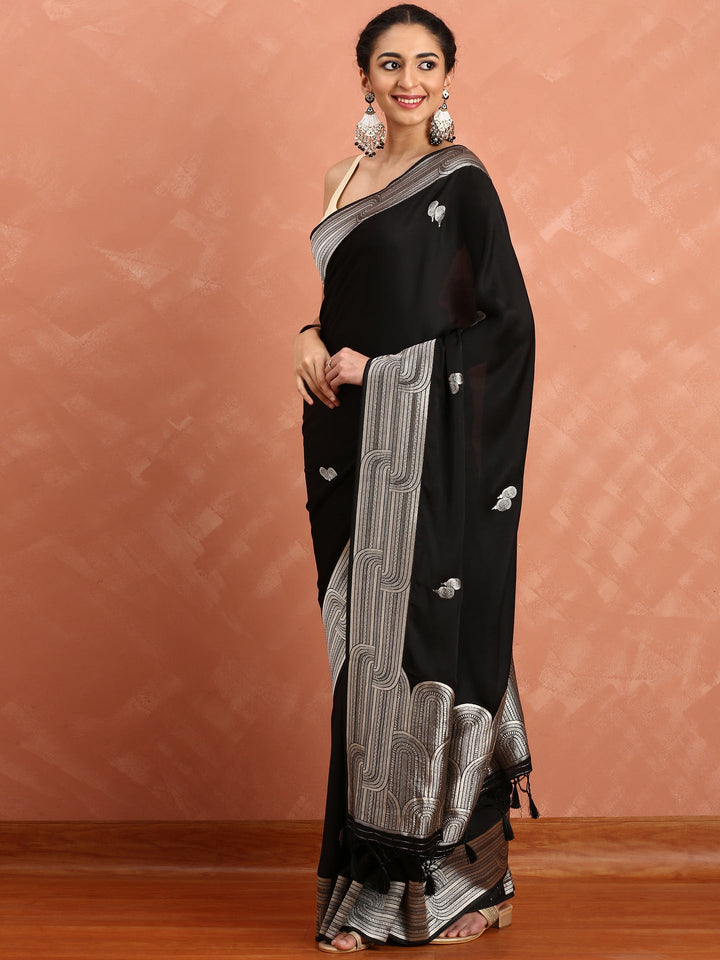 Neerus Black Banarasi woven saree with silver zari motifs - back view