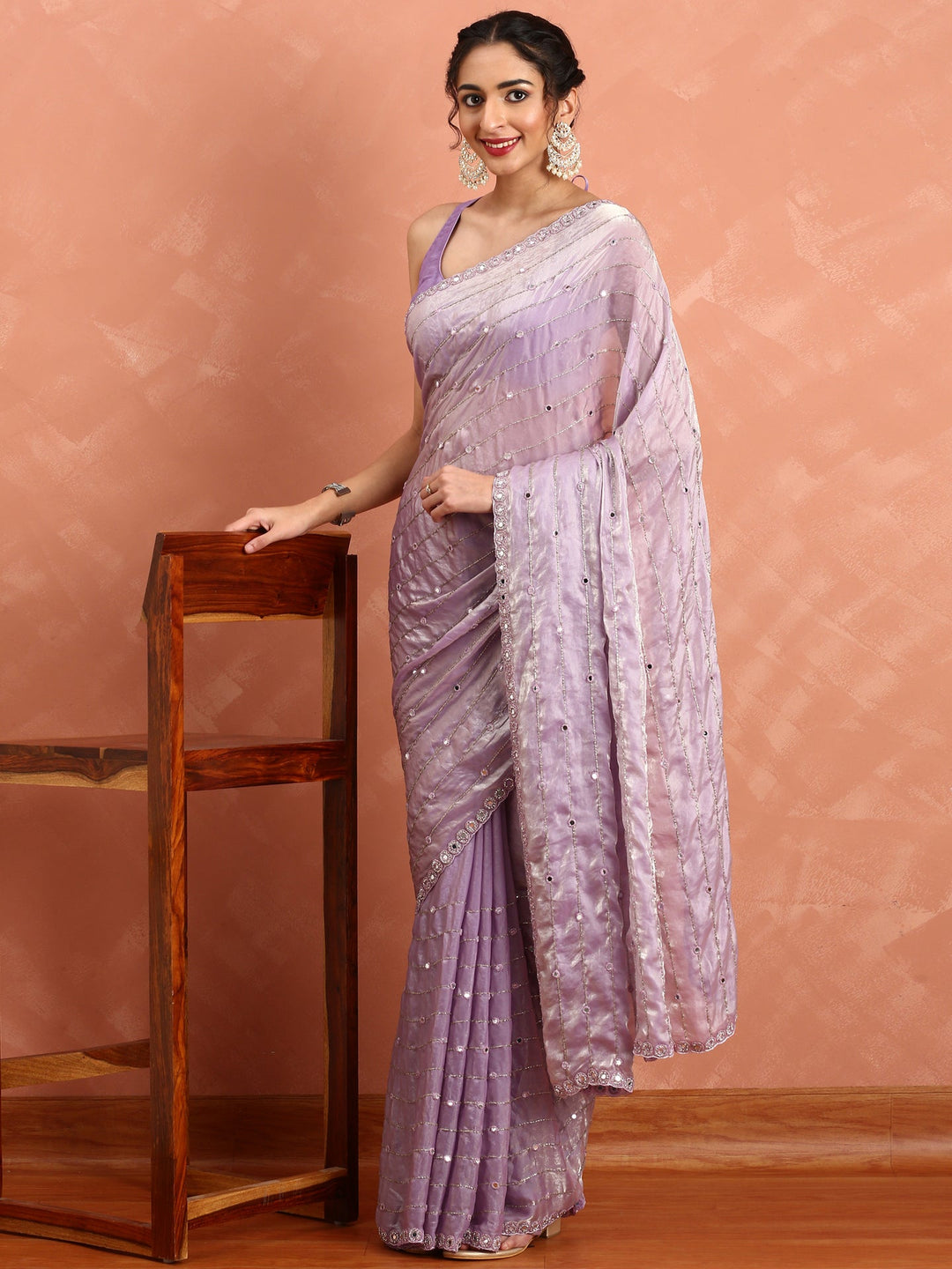 Neerus Purple tissue mirror work saree - back view