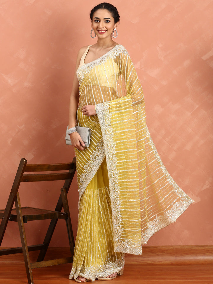 Neerus Yellow net hand embroidered saree - detail view 1
