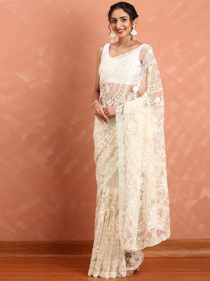 Neerus Beige net hand embroidered saree with pearl sequins - back view